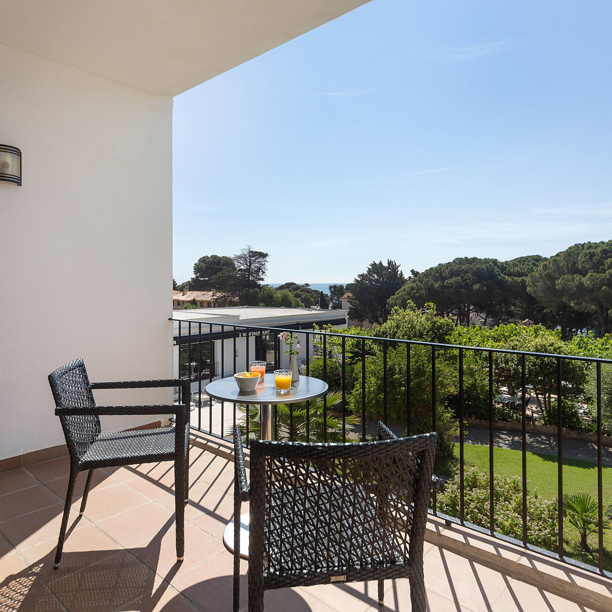a table and chairs on a balcony