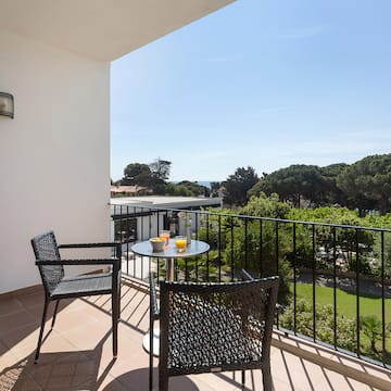 a table and chairs on a balcony