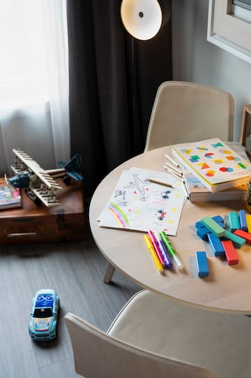 a table with toys and books on it