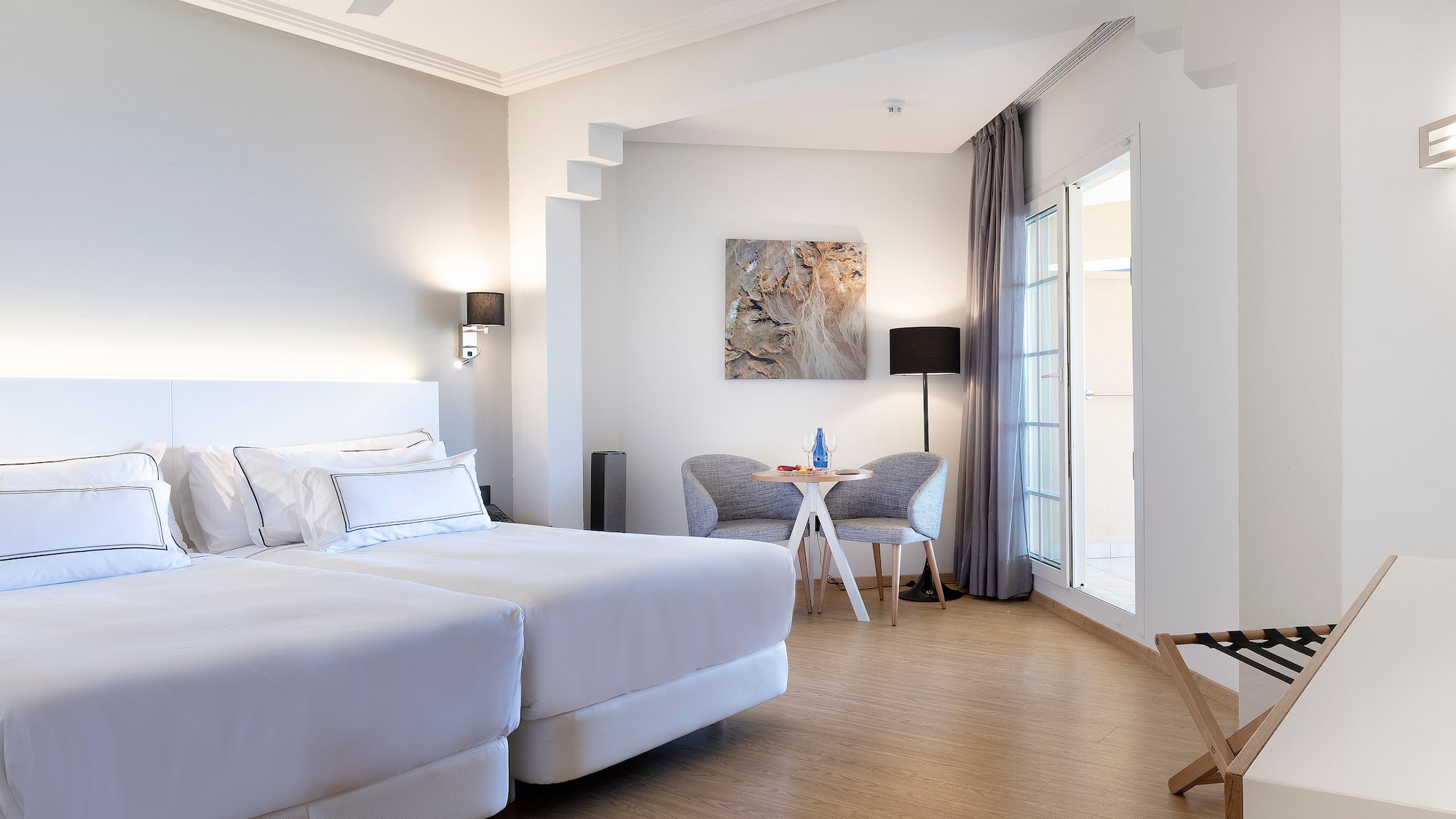 a room with a bed and a chair