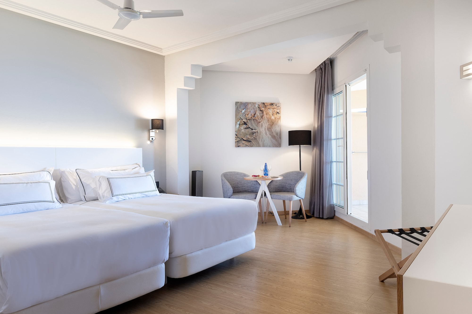 a room with a bed and a chair