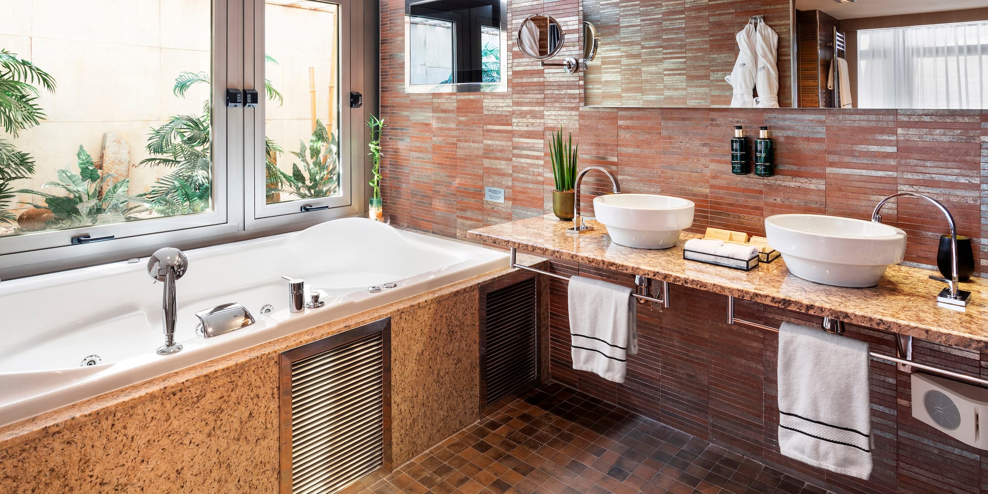 a bathroom with a tub and sink