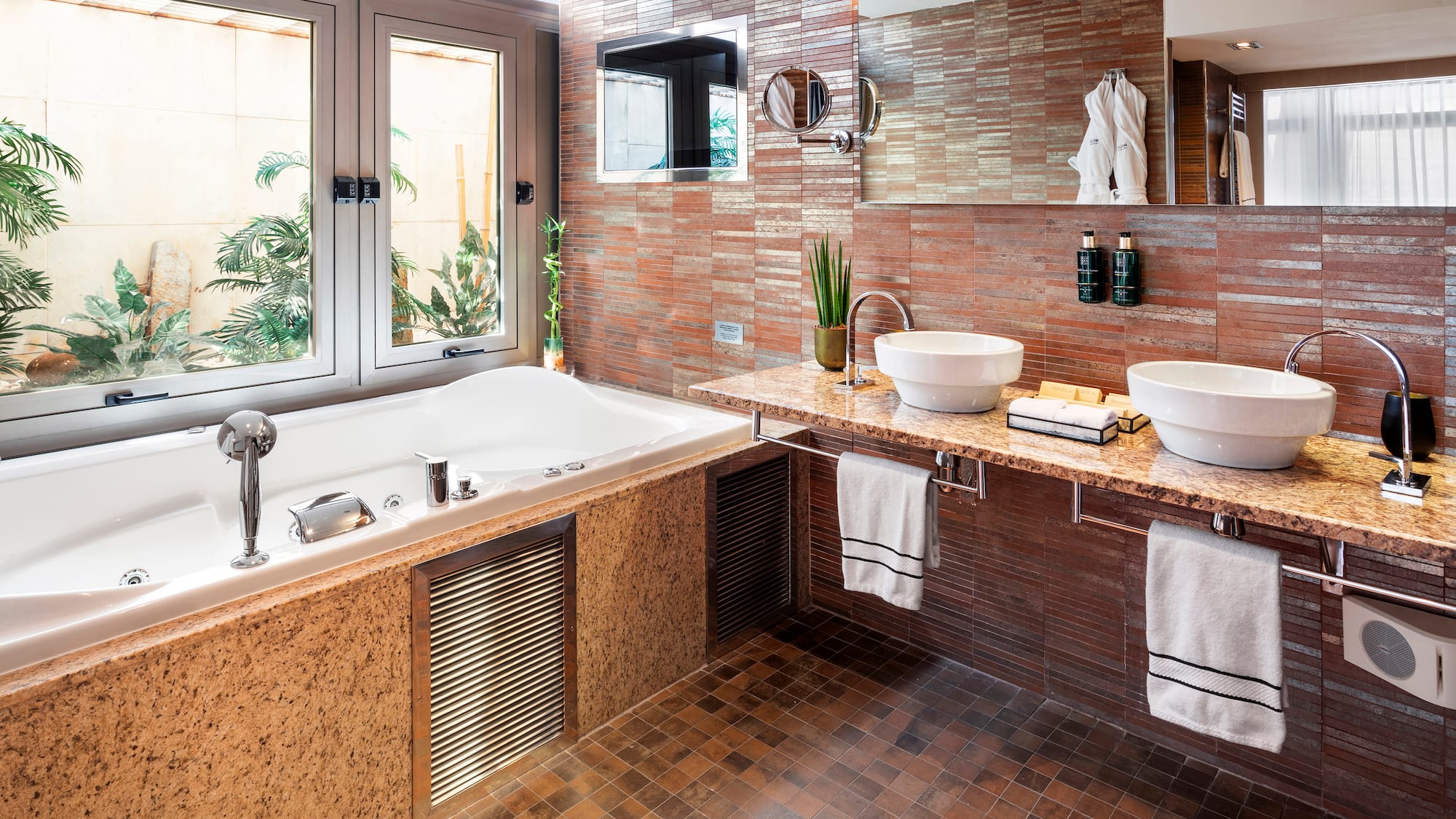 a bathroom with a tub and sink