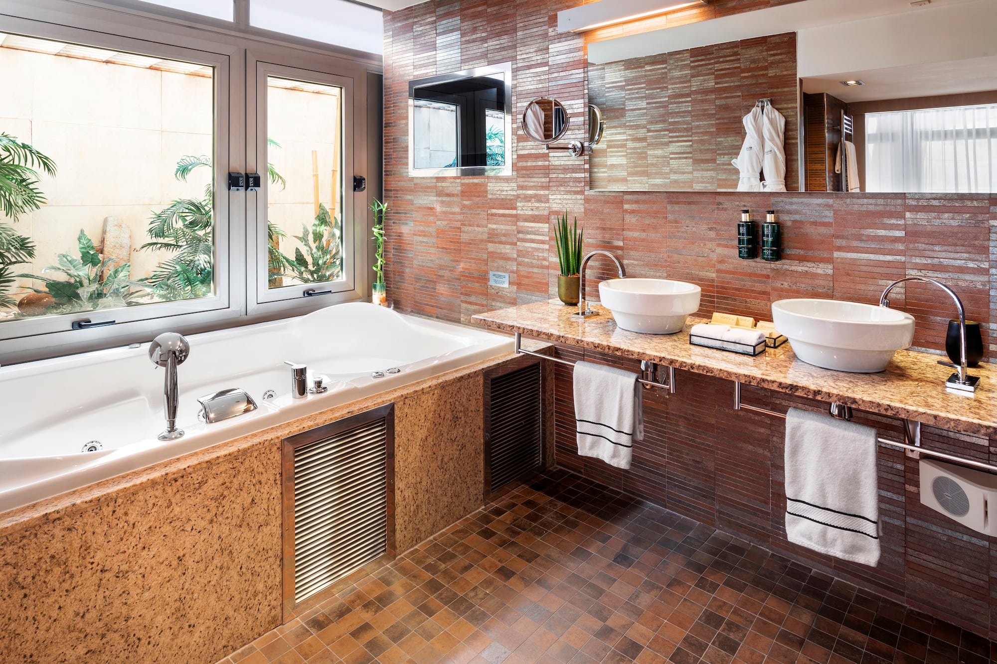 a bathroom with a tub and sink