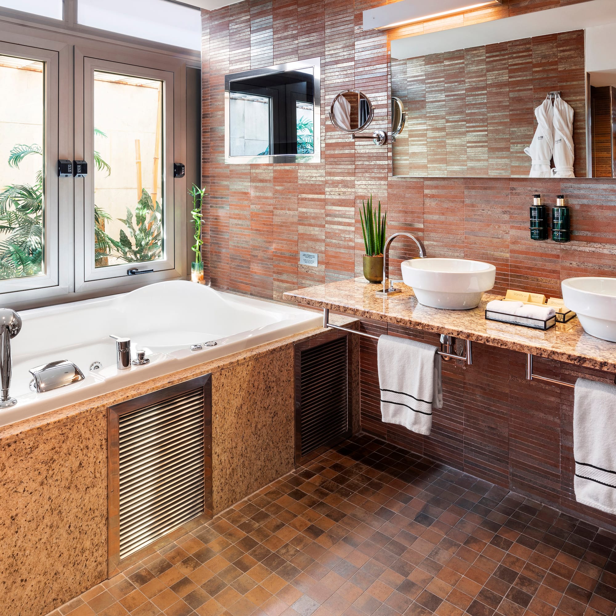 a bathroom with a tub and sink