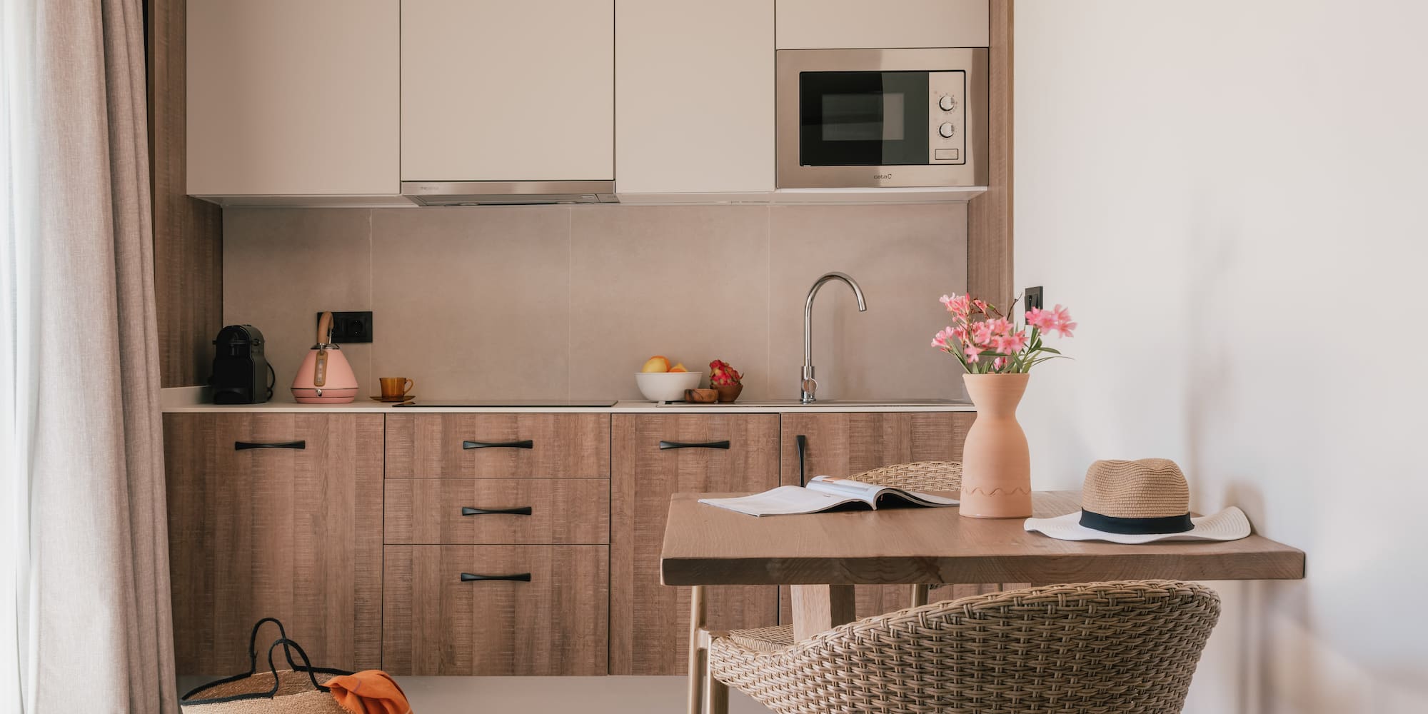 a kitchen with a table and chairs
