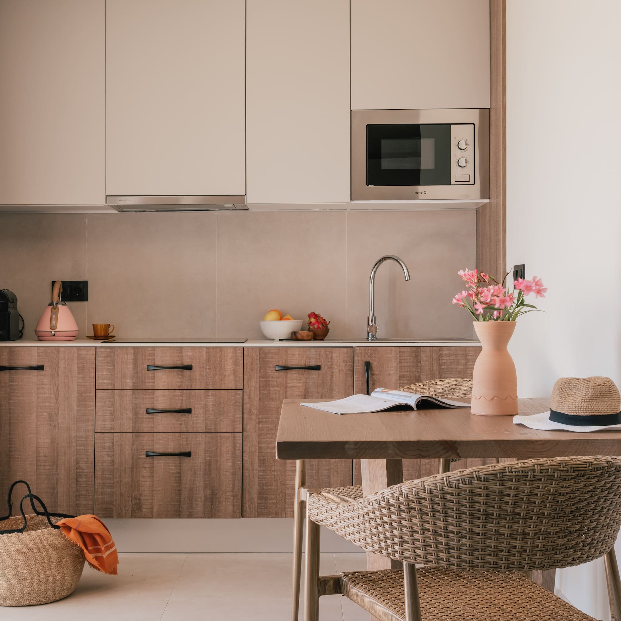 a kitchen with a table and chairs