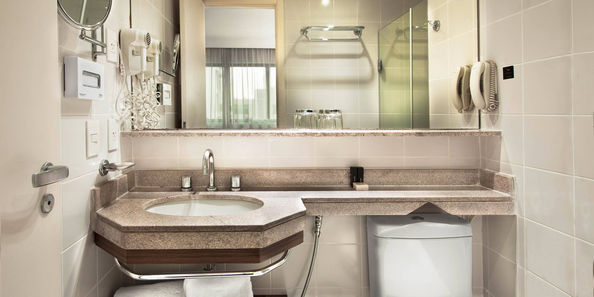 a bathroom with a sink and toilet