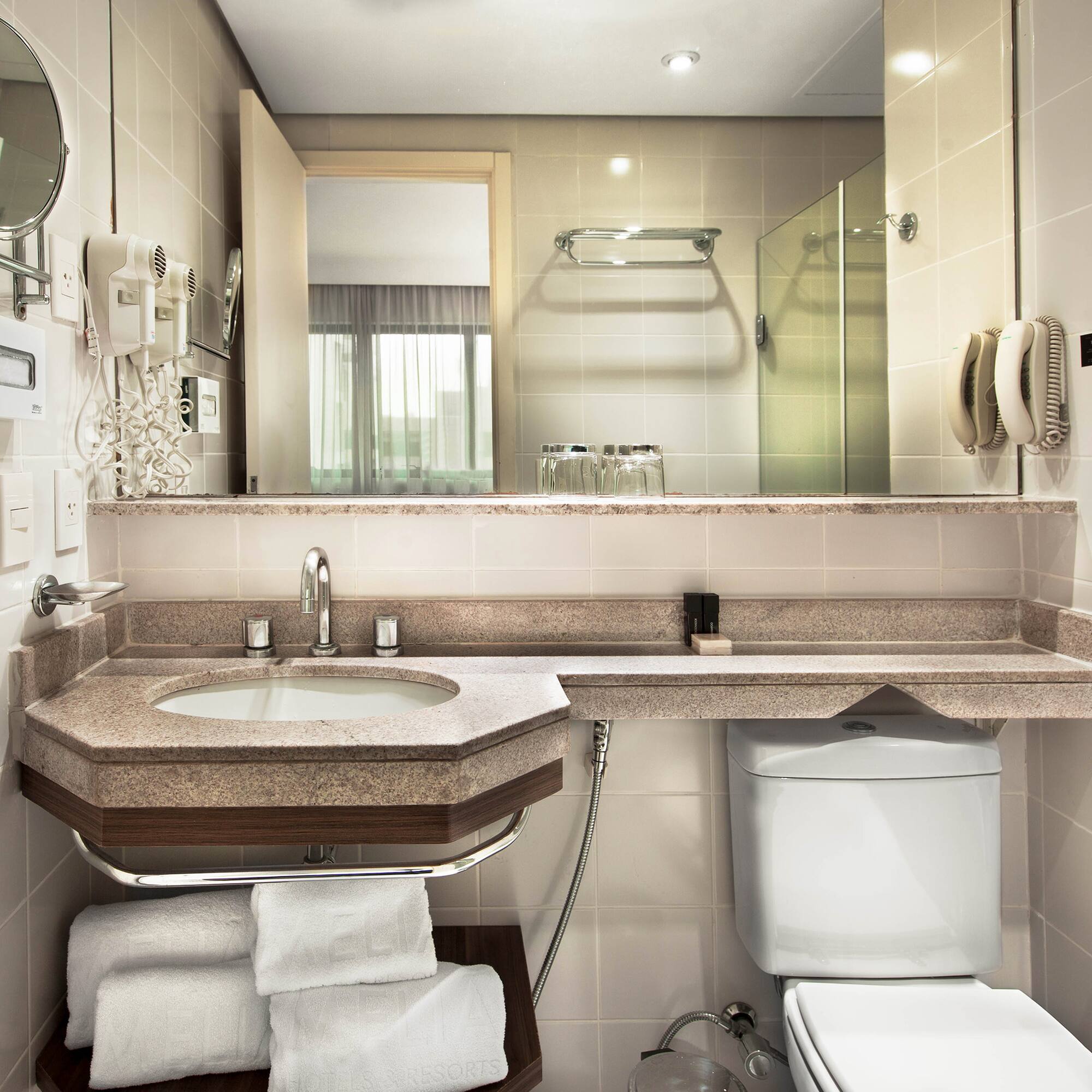 a bathroom with a sink and toilet