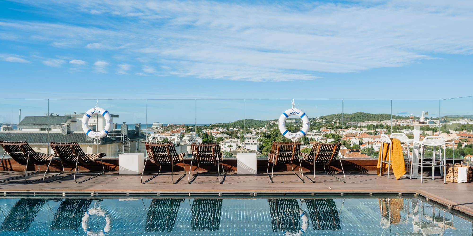 a pool with chairs and life preservers on it