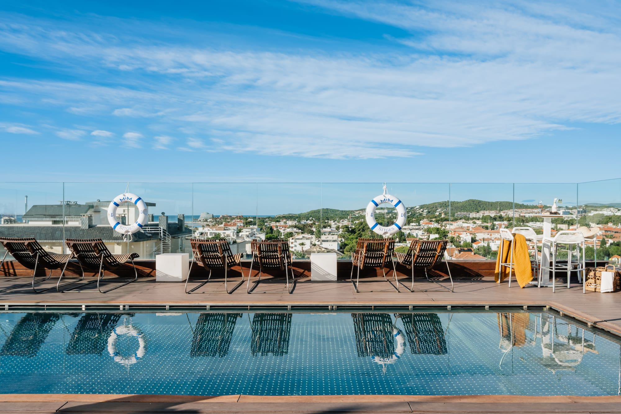 a pool with chairs and life preservers on it