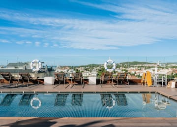 a pool with chairs and life preservers on it