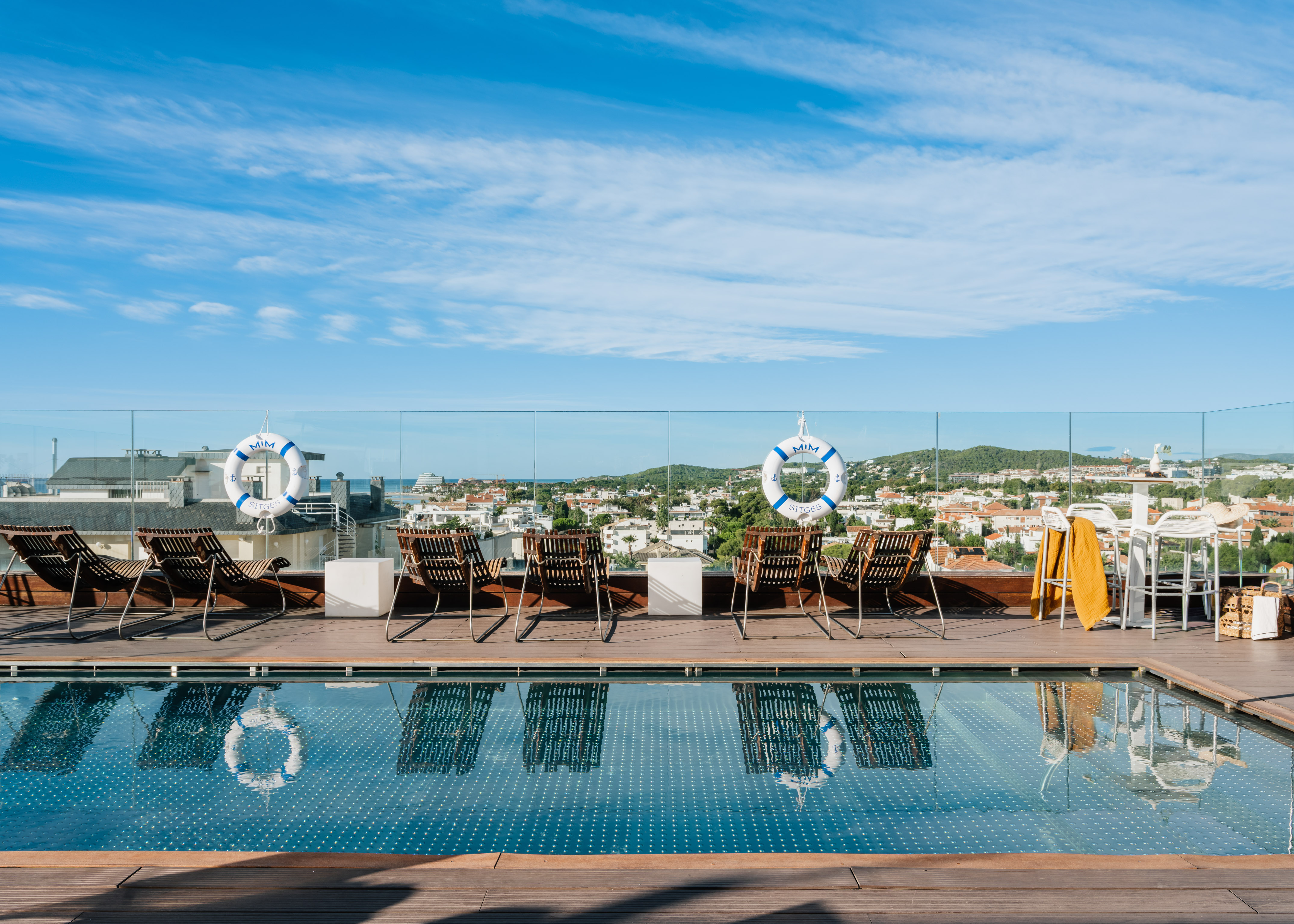 a pool with chairs and life preservers on it