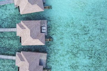 a group of houses on water