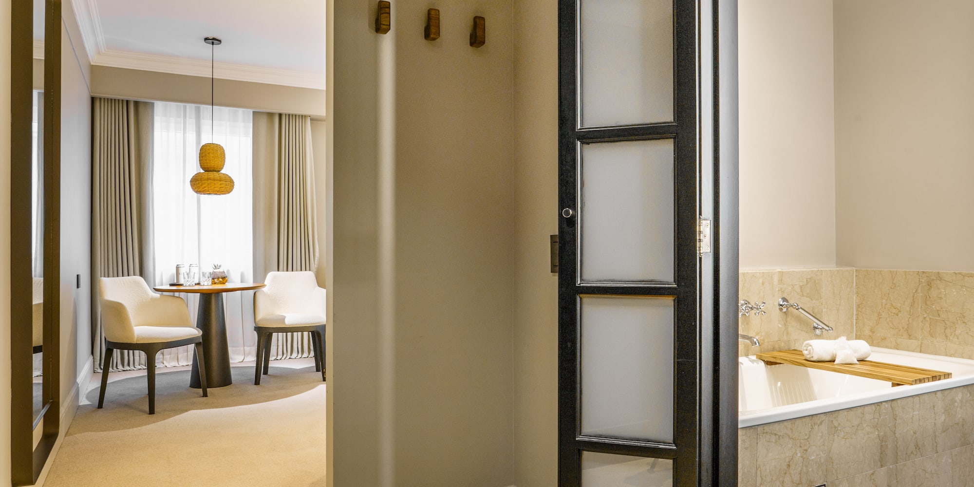 a room with a door and a bathtub