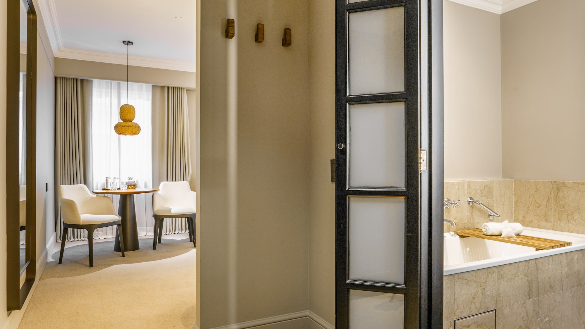 a room with a door and a bathtub