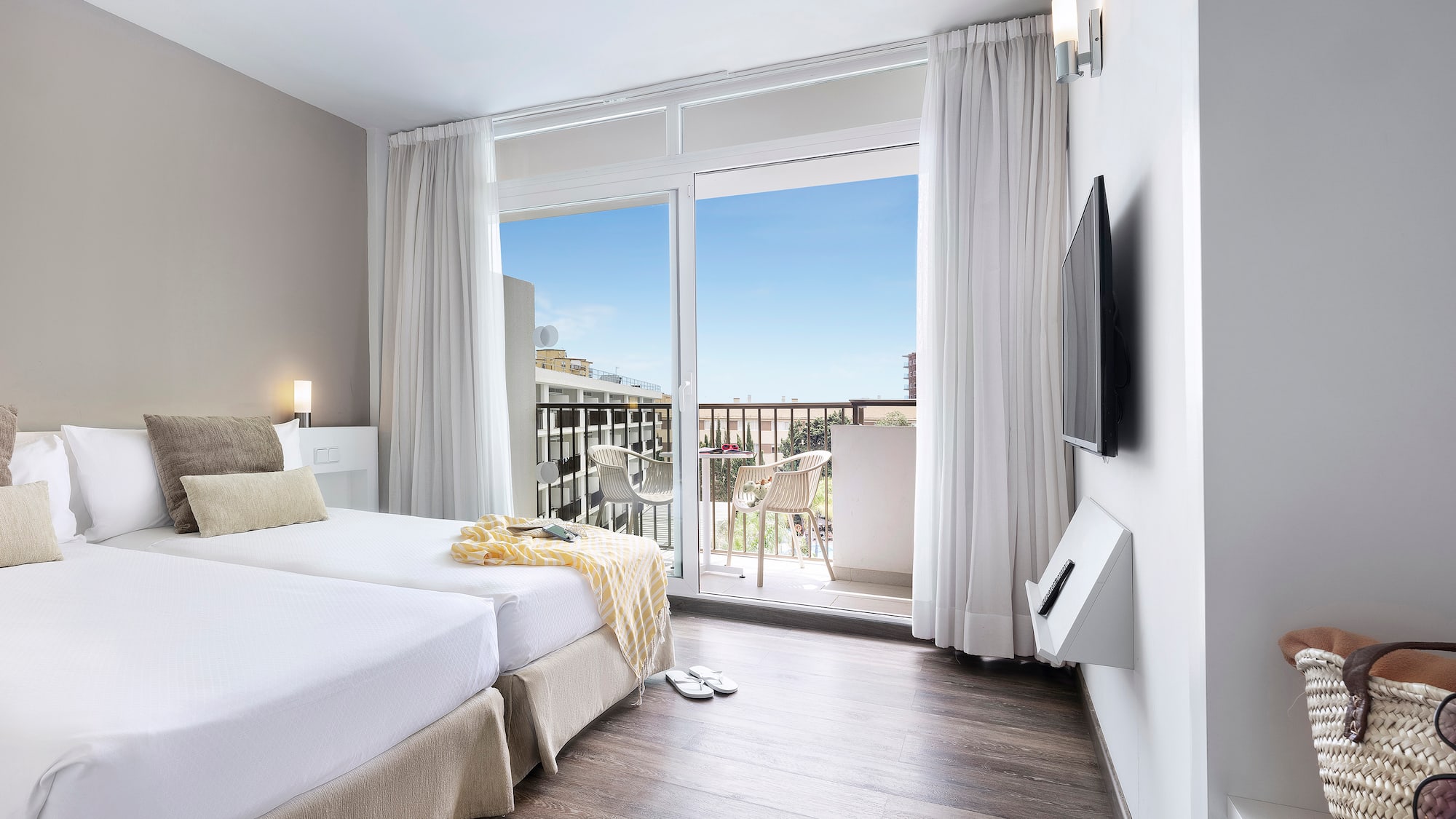 a room with a large window and a balcony