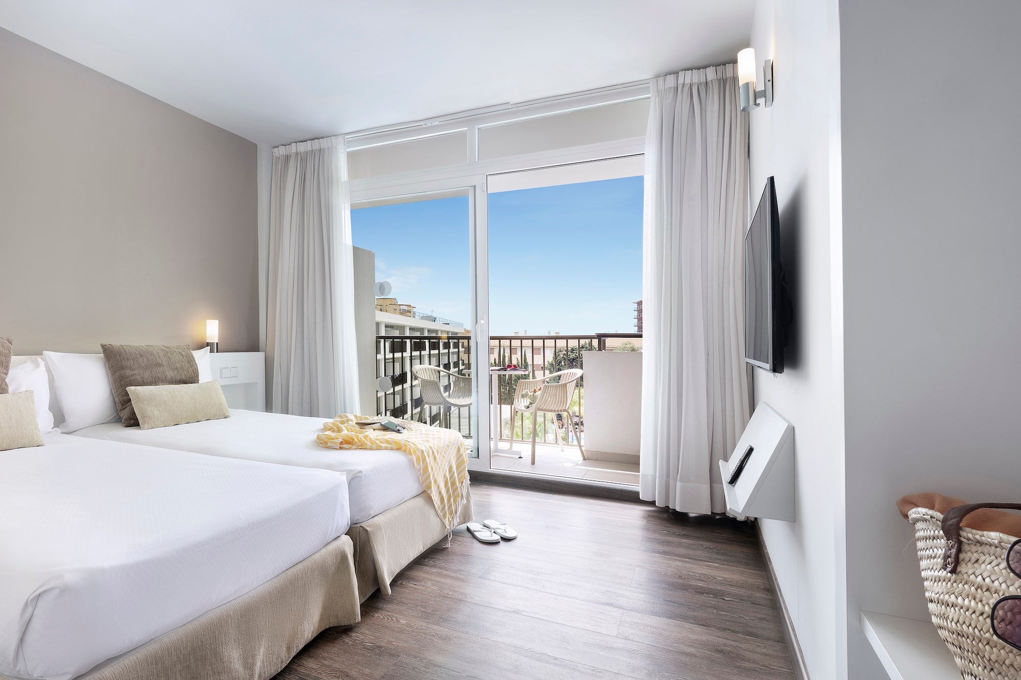 a room with a large window and a balcony