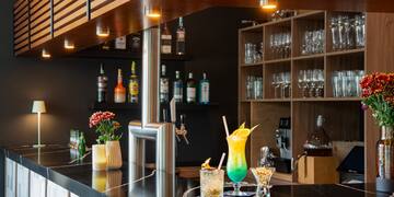 a bar with drinks on it