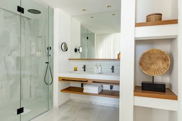 a bathroom with a shower and a sink
