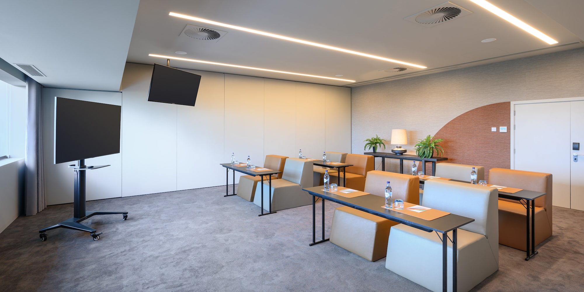 a room with a television and tables