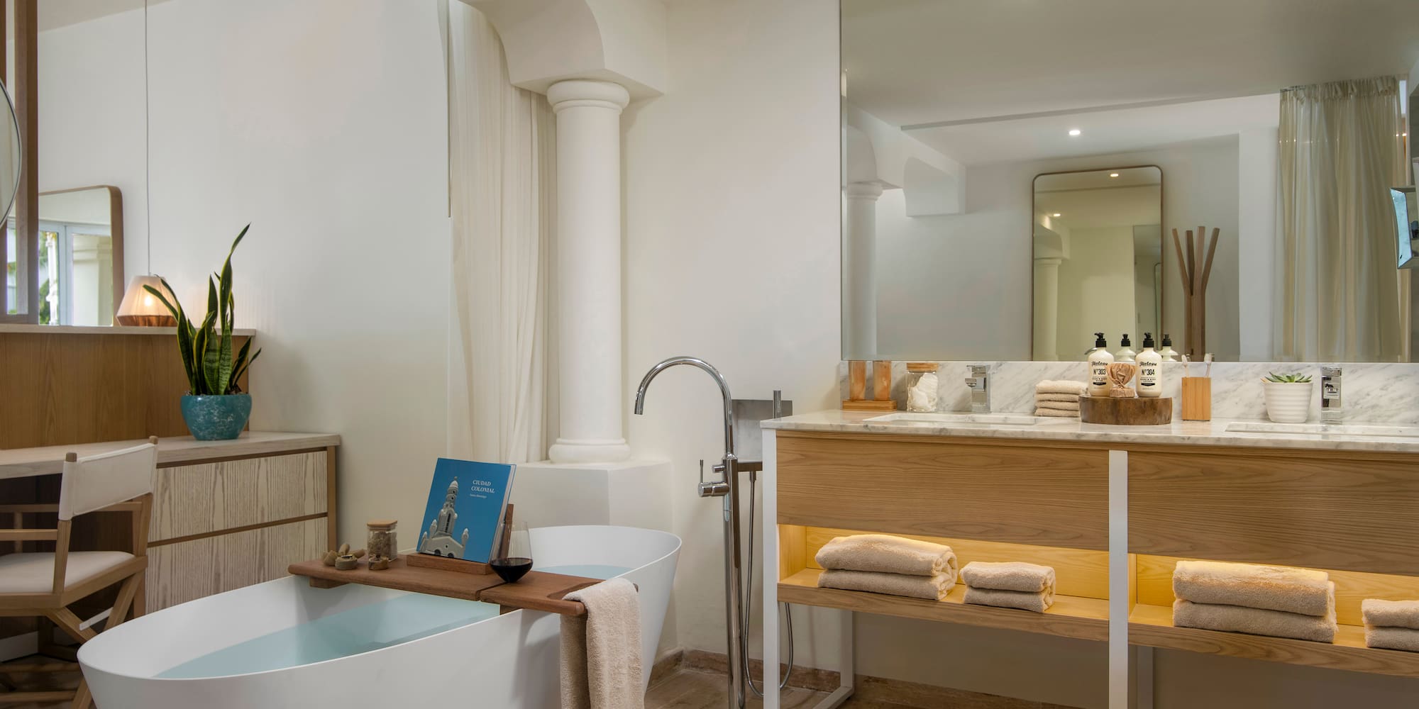 a bathroom with a tub and a sink