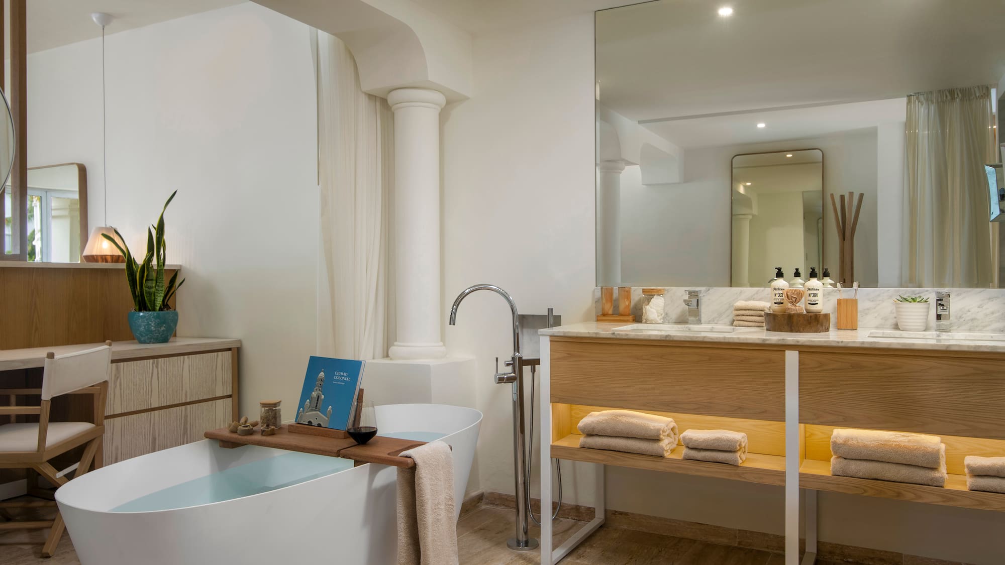 a bathroom with a tub and a sink