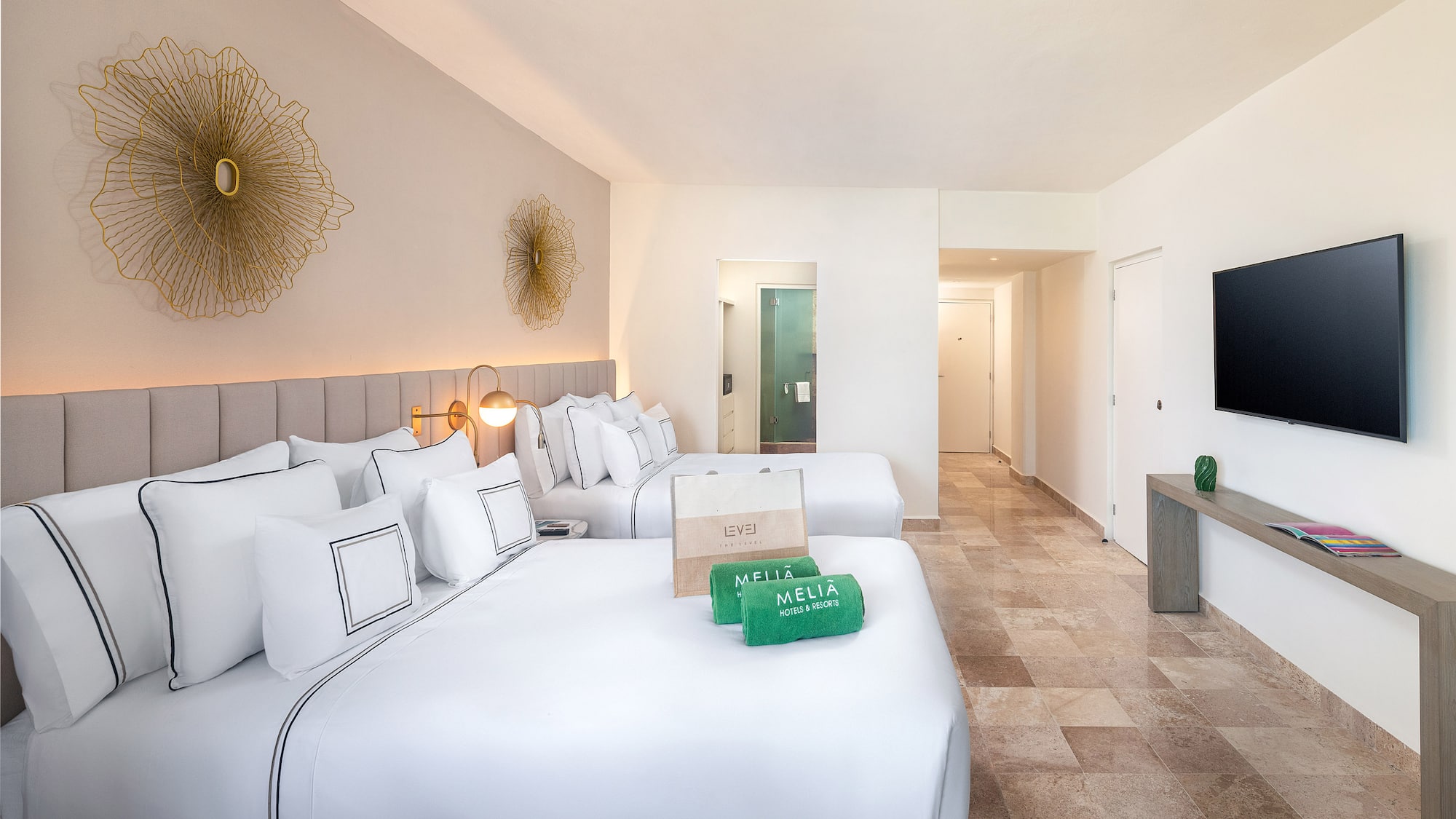 a hotel room with a bed and a mirror