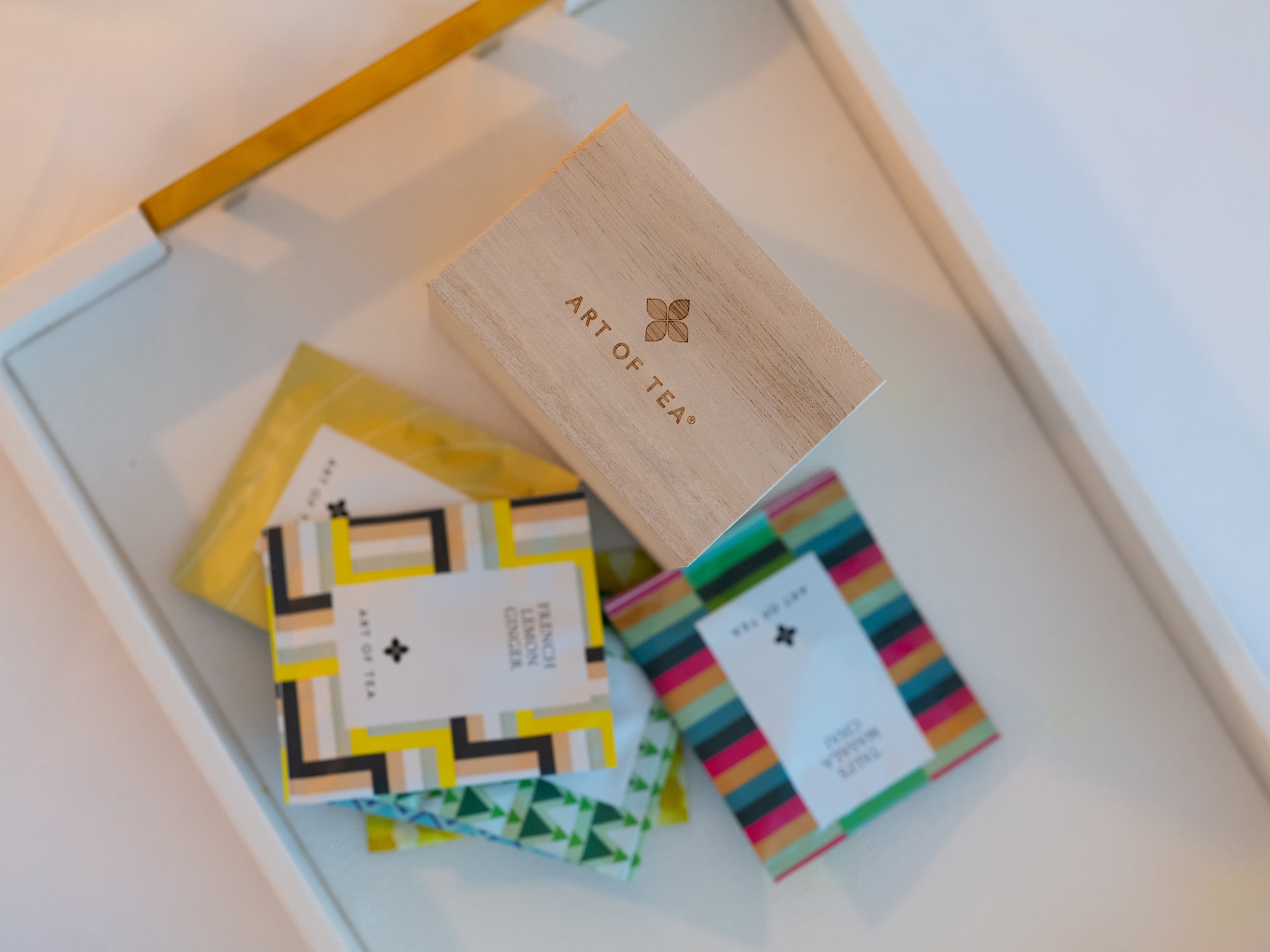 a box featuring a logo beside a pile of vibrant cards