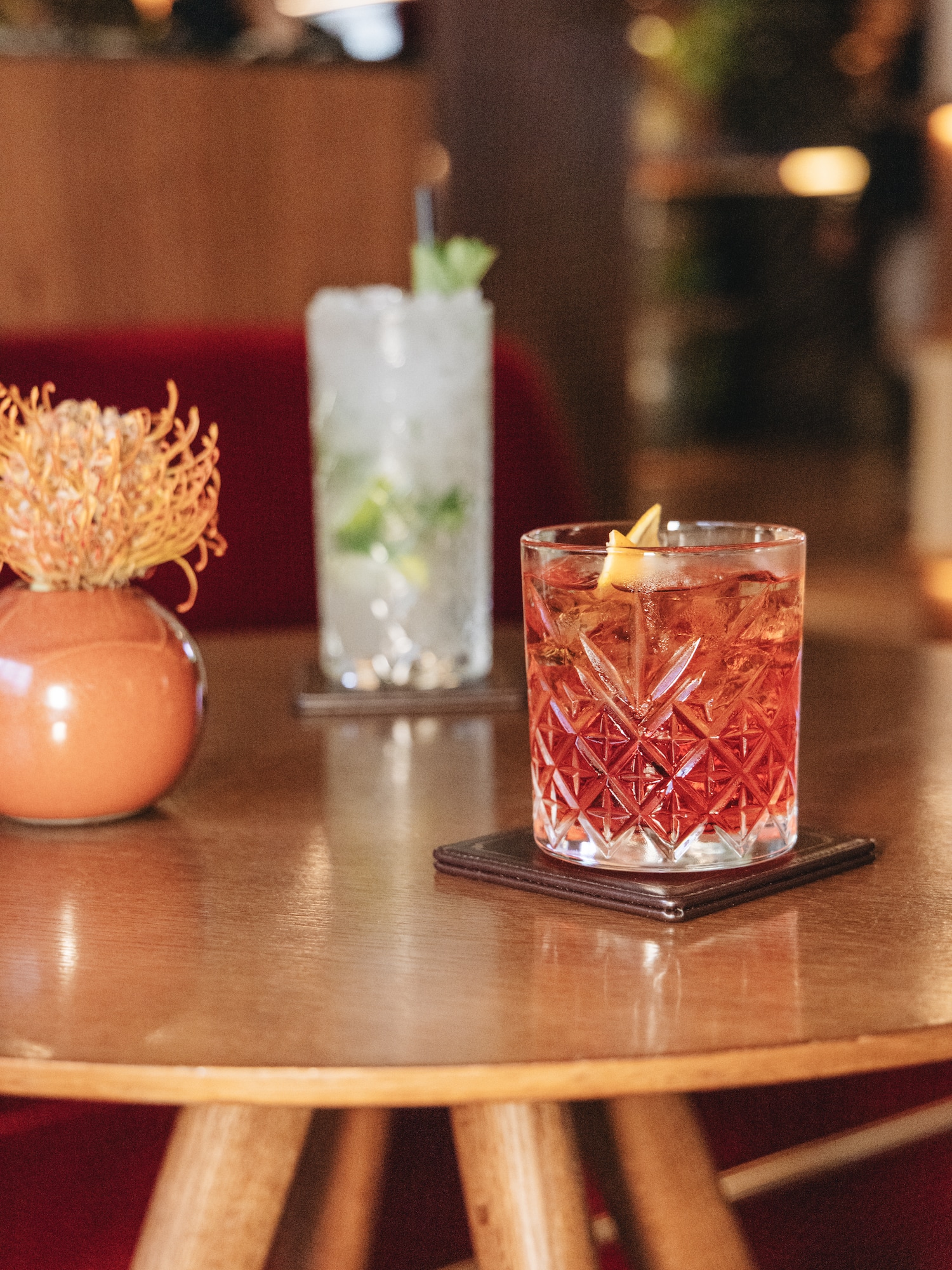 a glass of liquid on a table