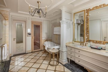 a bathroom with a tub and sink