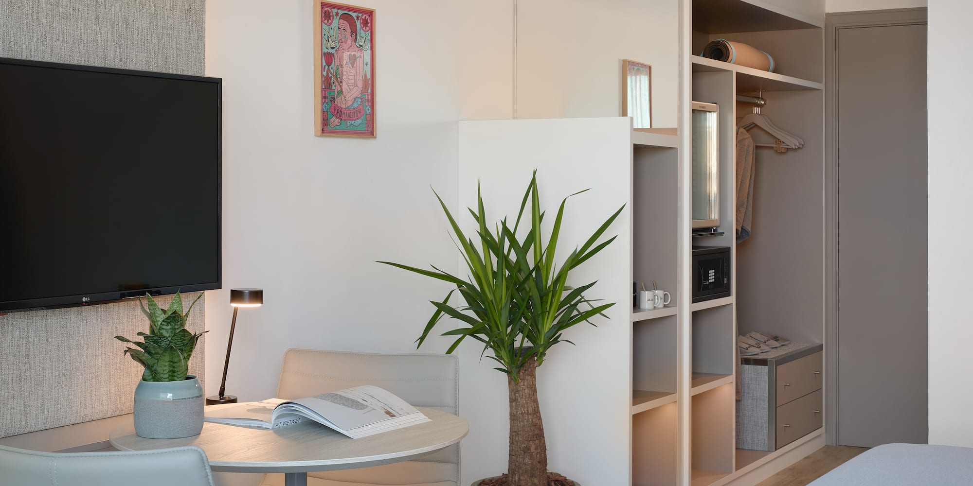 a room with a tv and a table