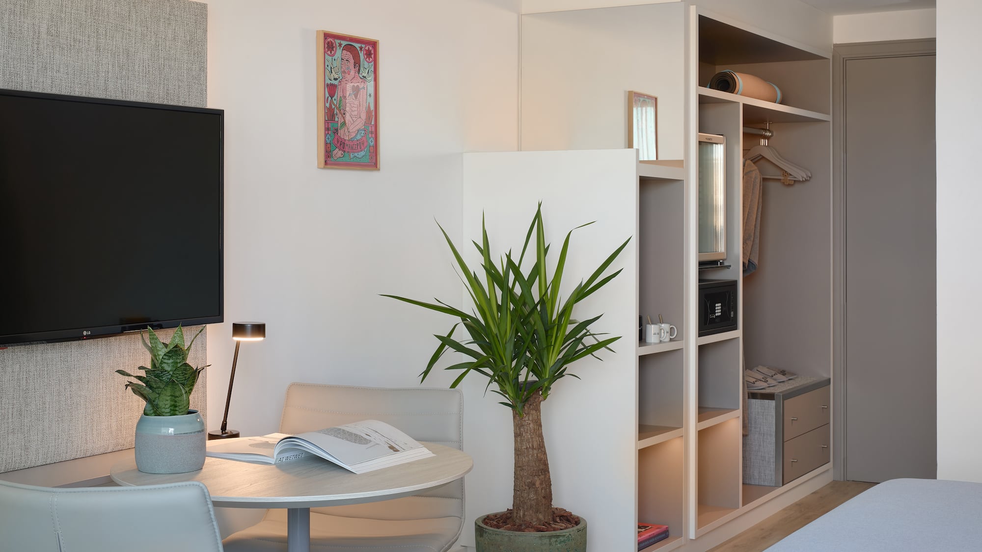 a room with a tv and a table