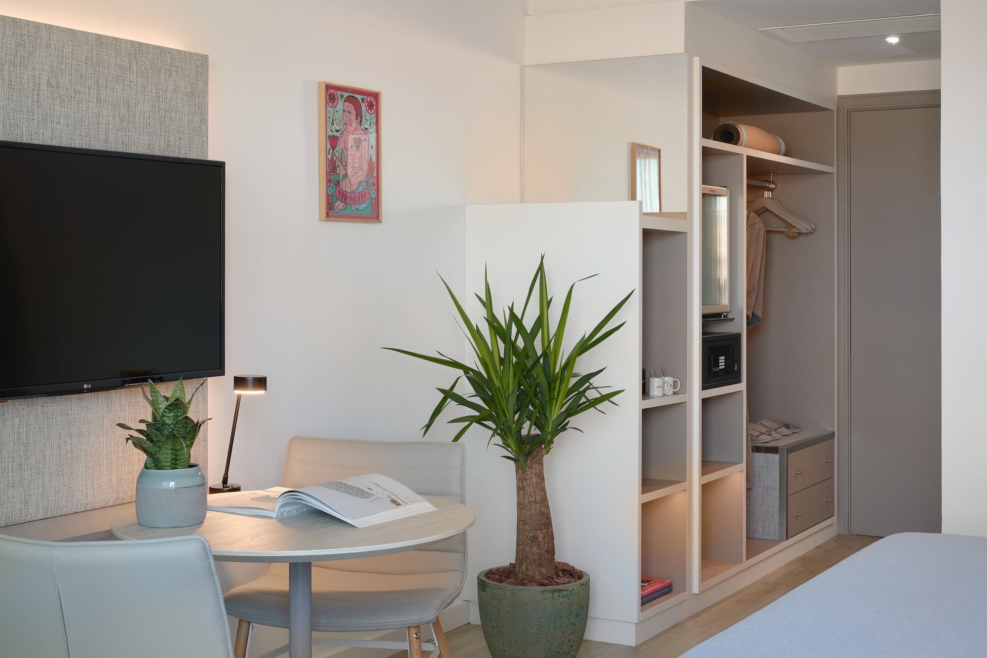 a room with a tv and a table