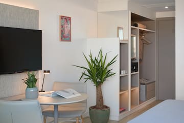 a room with a tv and a table