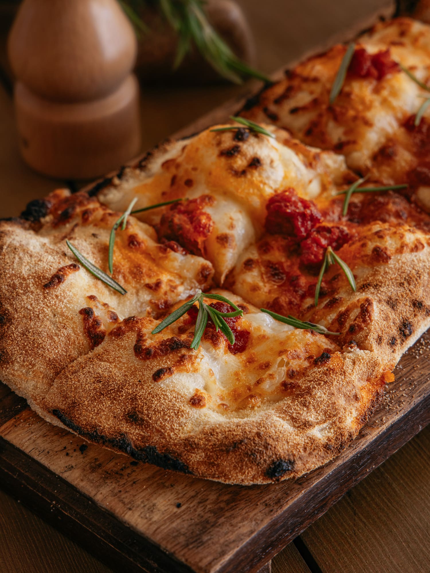 a pizza on a wooden board