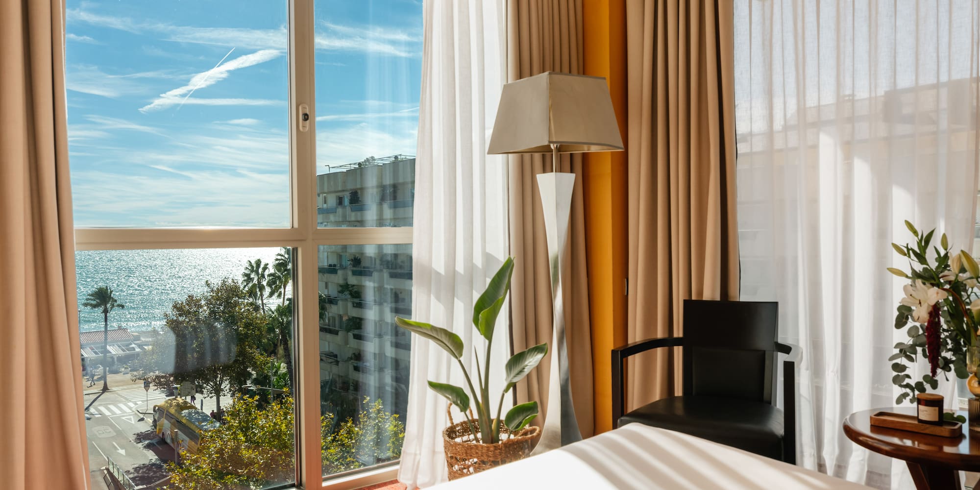 a room with a bed and a lamp