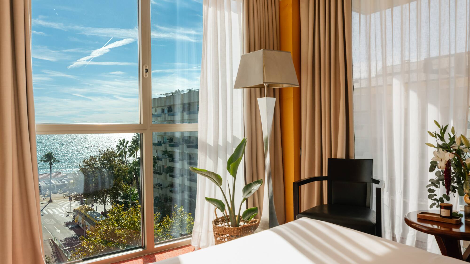 a room with a bed and a lamp