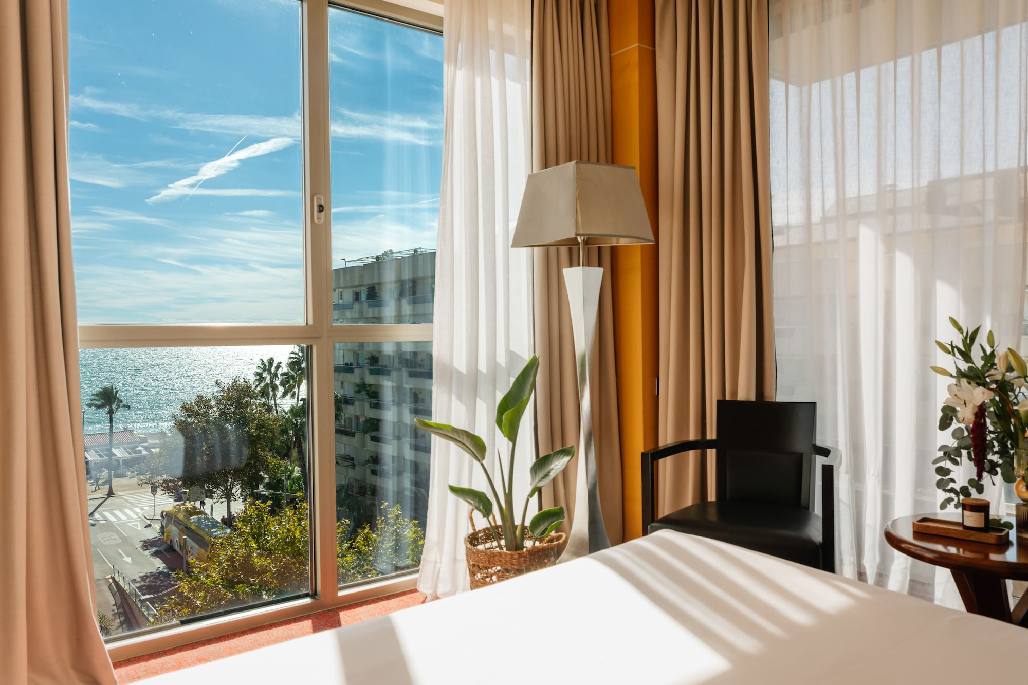 a room with a bed and a lamp