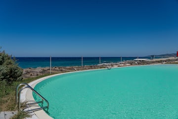 a large pool with a body of water