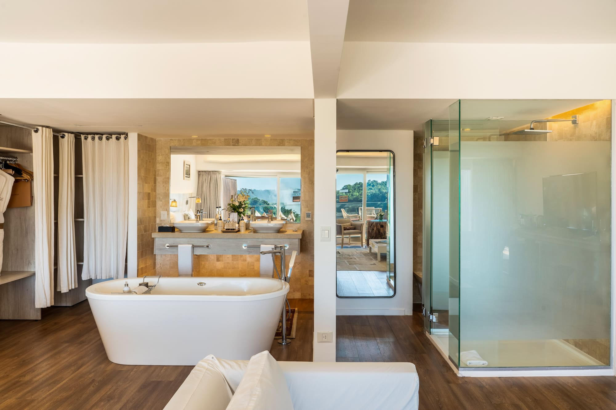 a bathroom with a tub and a shower