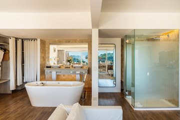 a bathroom with a tub and a shower