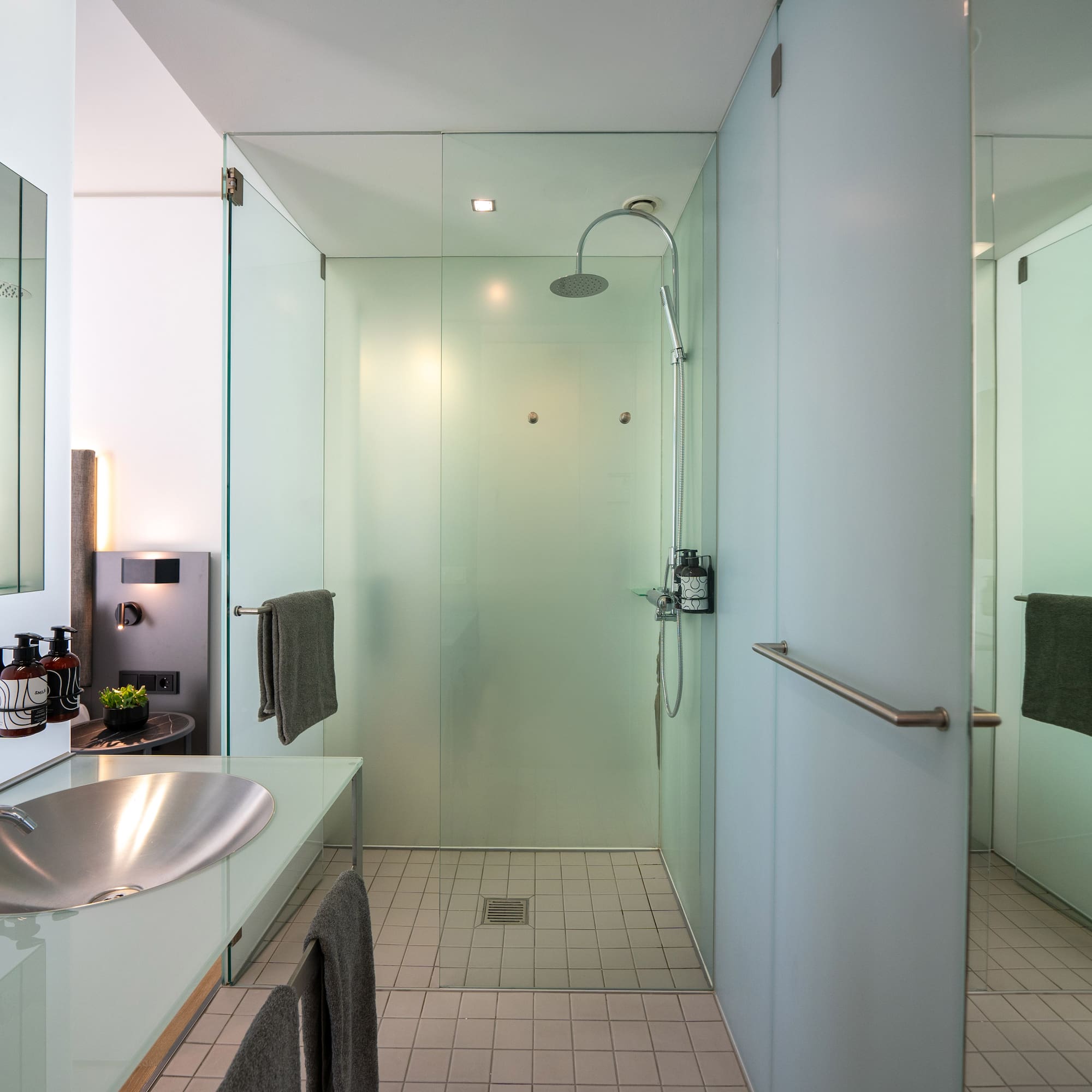 a bathroom with a sink and shower