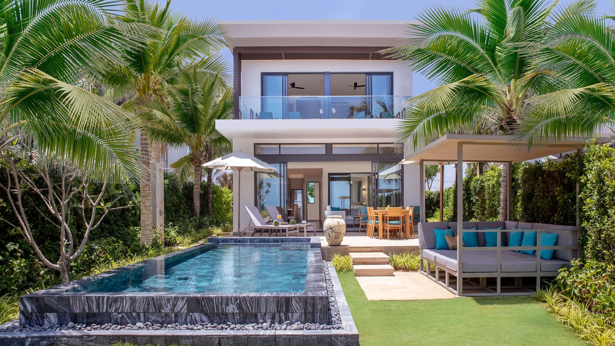 a pool in front of a house