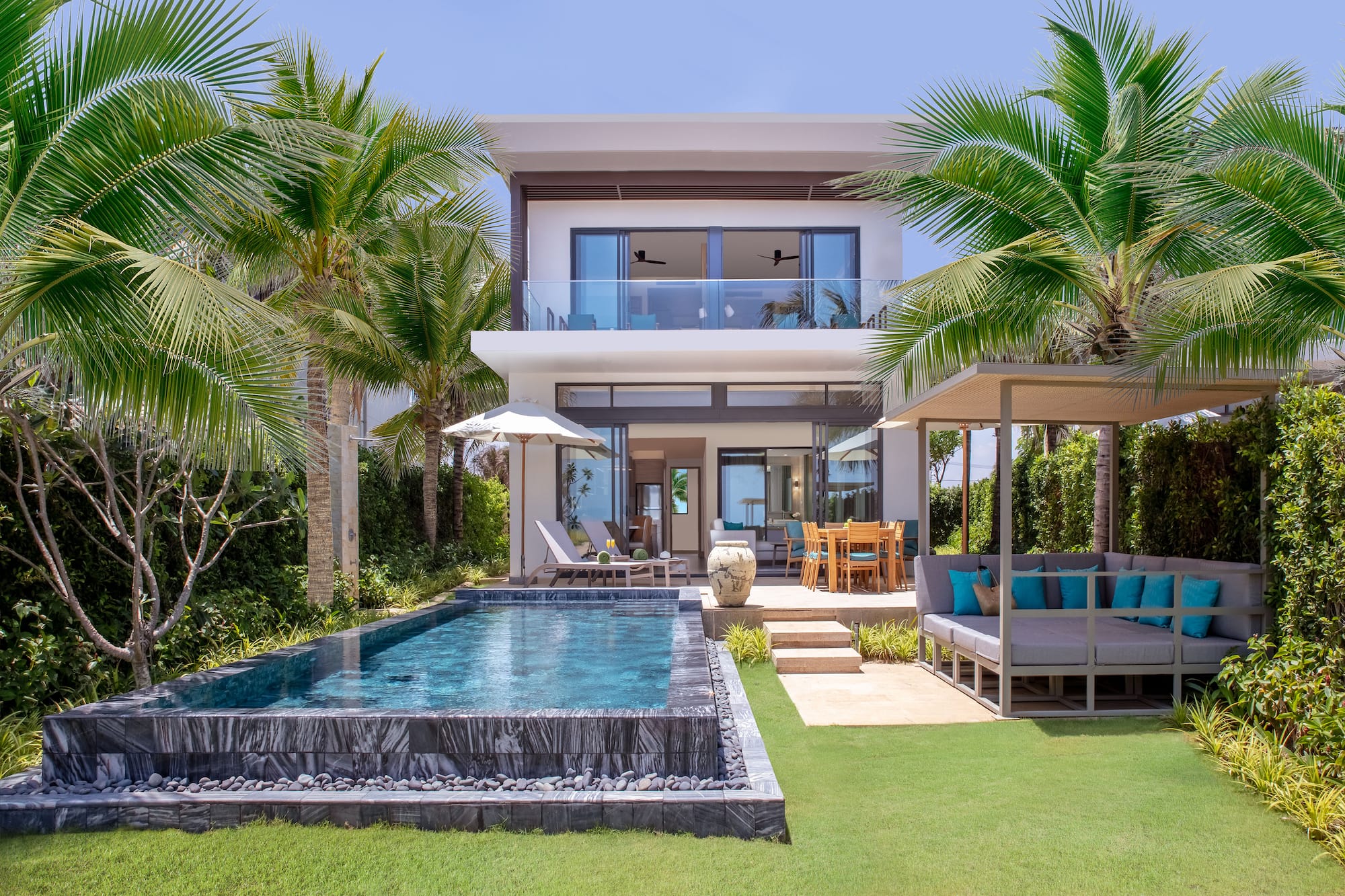 a pool in front of a house