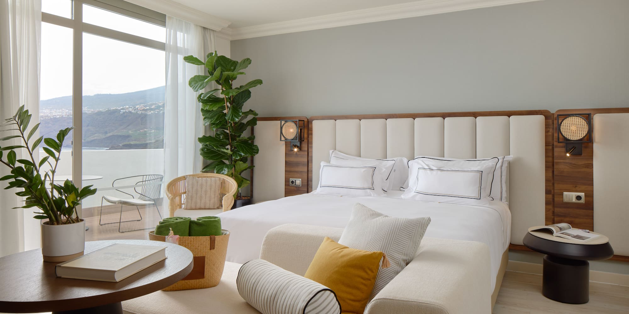 a bedroom with a large bed and a table