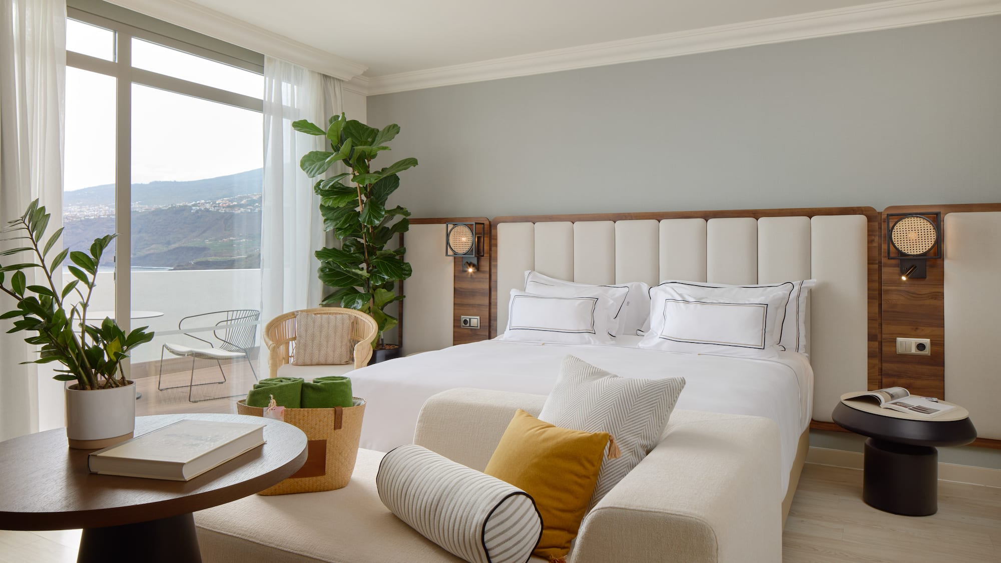 a bedroom with a large bed and a table