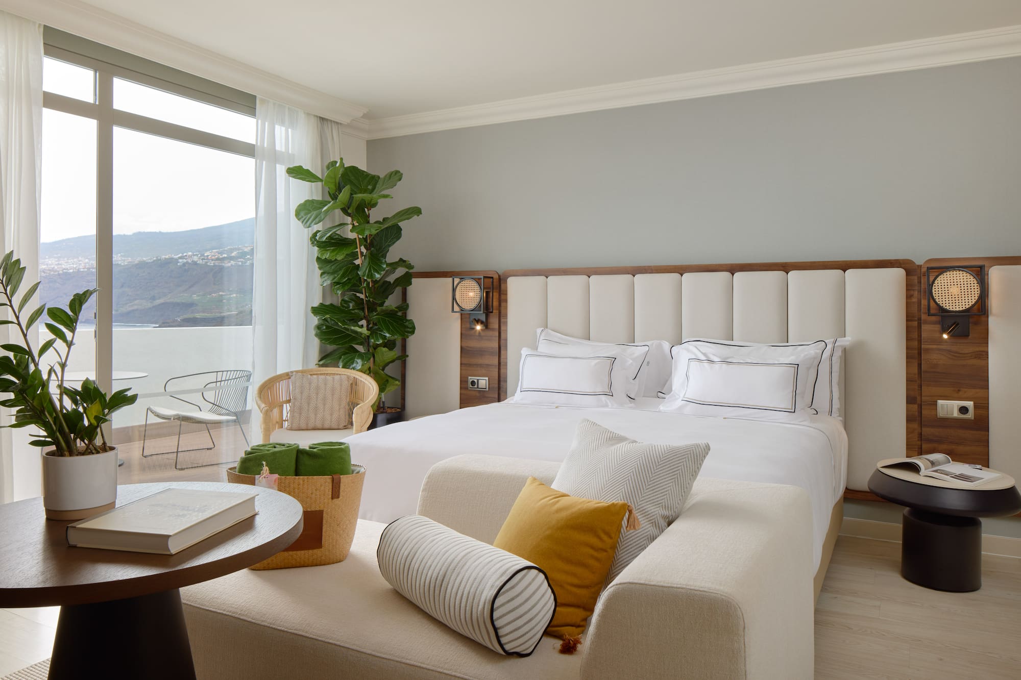 a bedroom with a large bed and a table