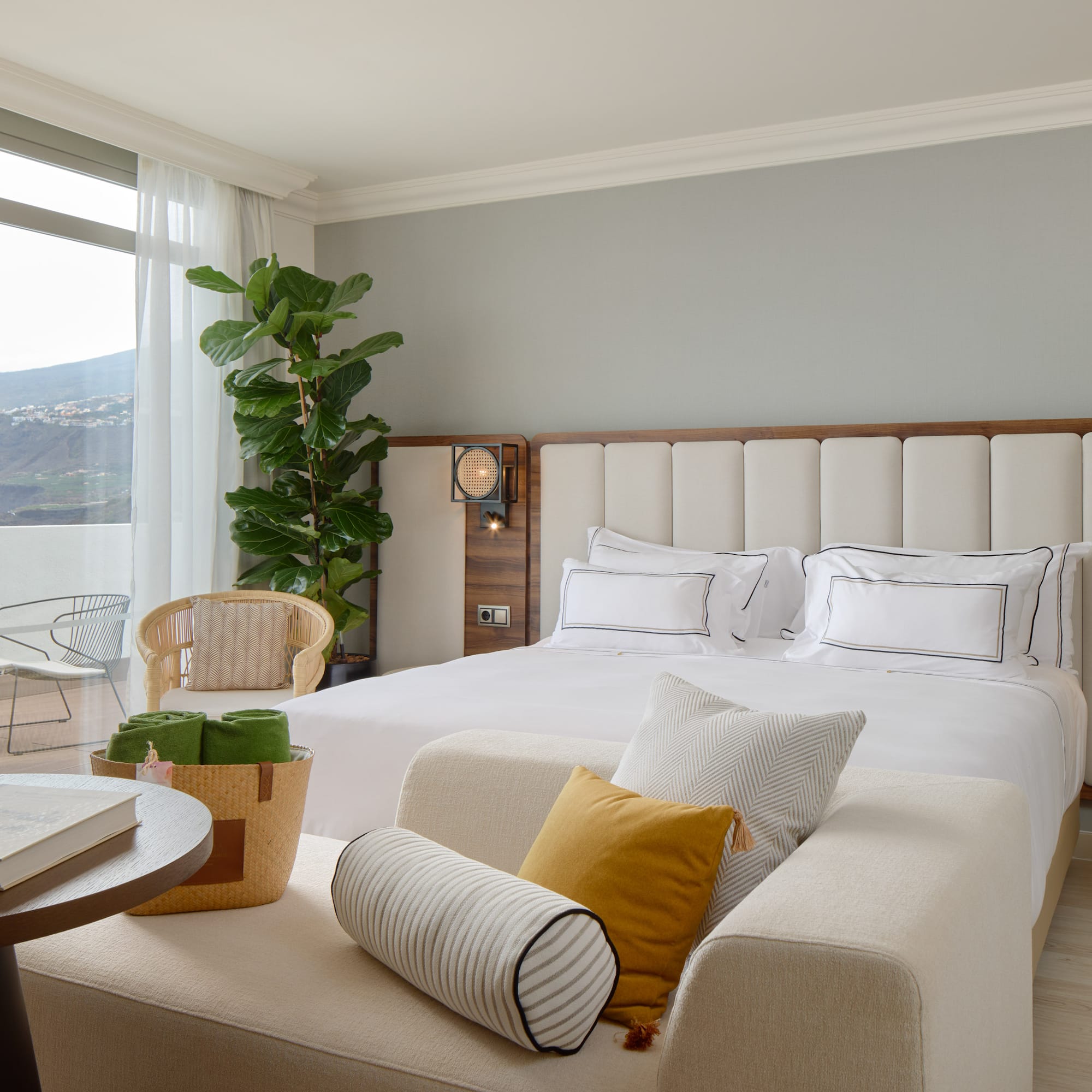 a bedroom with a large bed and a table