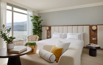 a bedroom with a large bed and a table